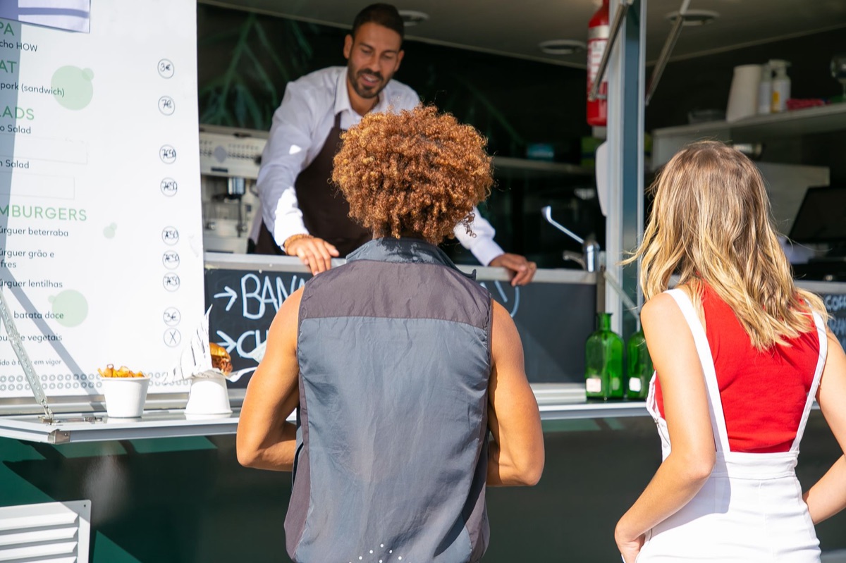 taco truck customer interaction, food truck, customer ordering, street food