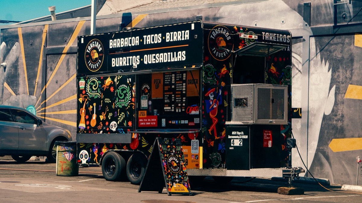 taco truck window with steaming tacos