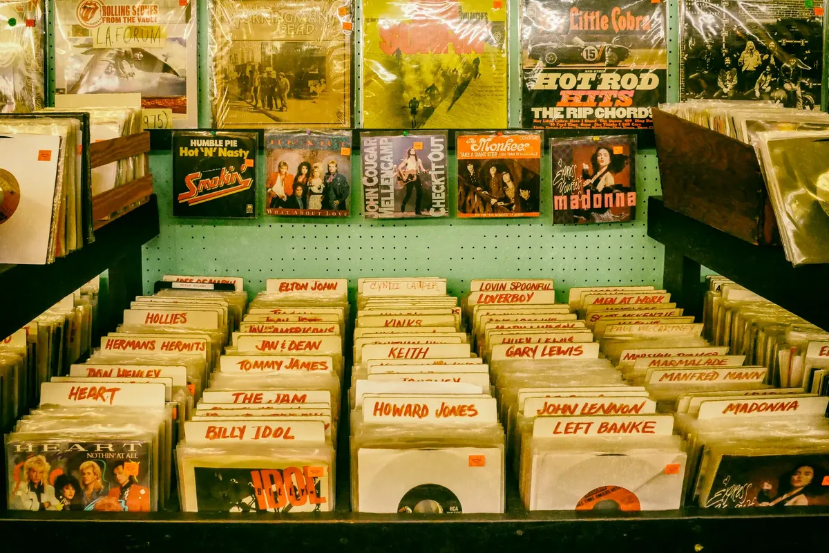 Explore a classic music store featuring vintage vinyl records and rock albums, showcasing retro vibes.
