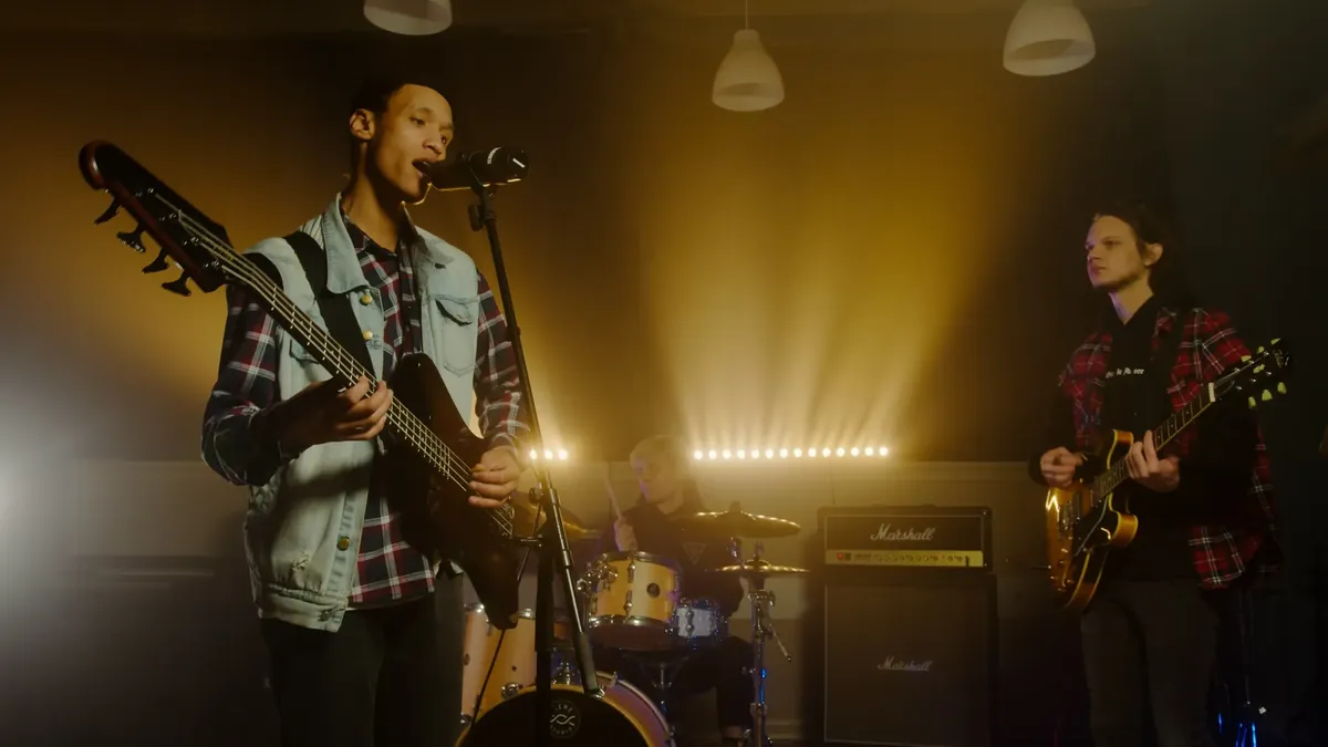 Dynamic band playing music with captivating stage lights and instruments.